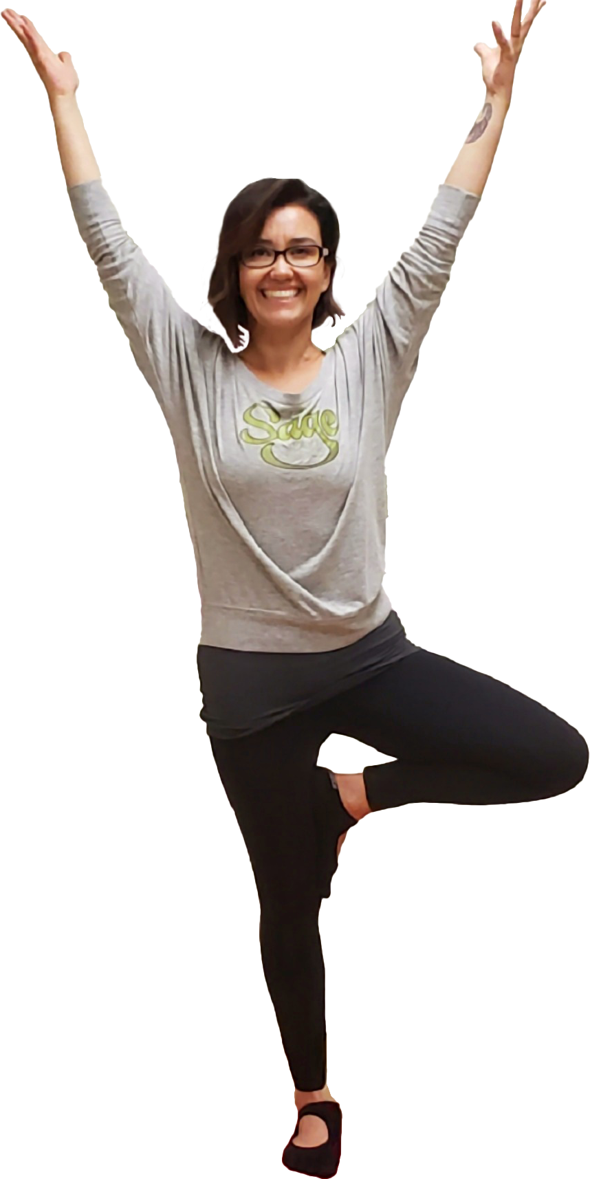 A woman is standing on one leg in a yoga pose with her arms in the air.