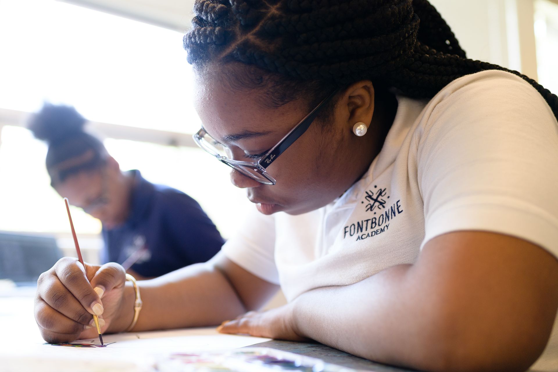 a woman wearing a white shirt with the word financial on it