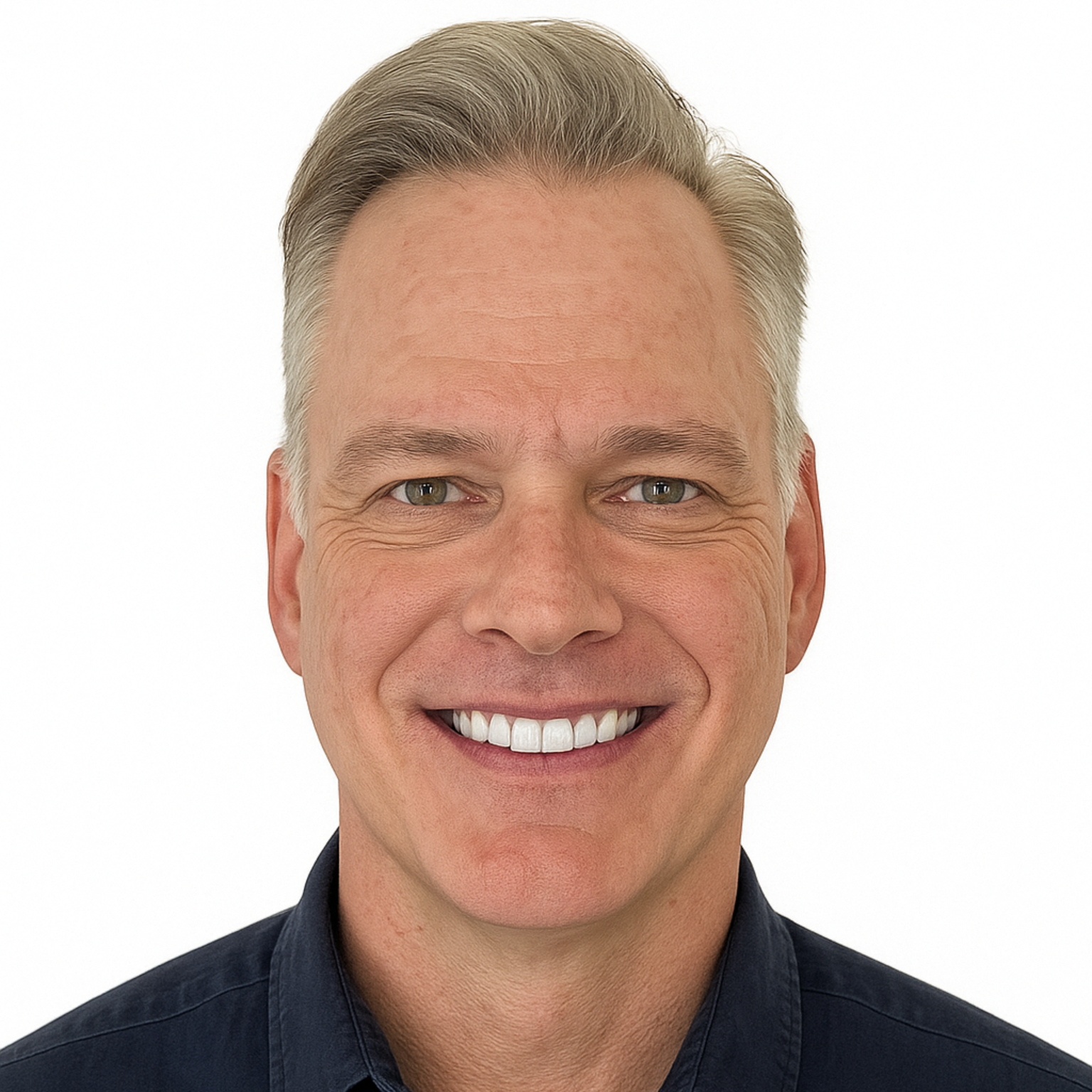 Smiling man in a dark shirt against a white background