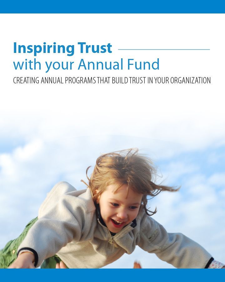 A child is flying through the air with the words inspiring trust with your annual fund