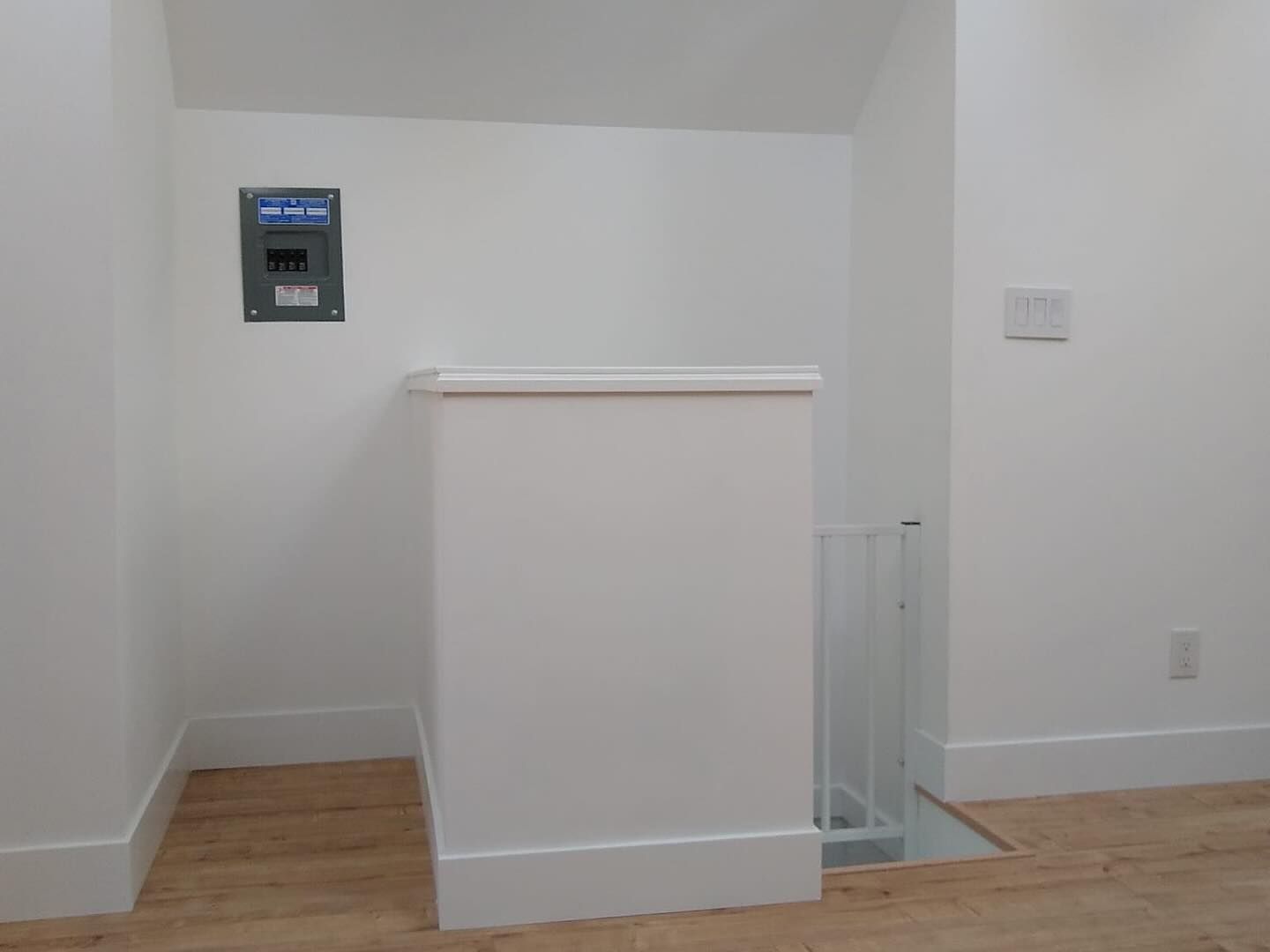 There is a staircase in the corner of the room.