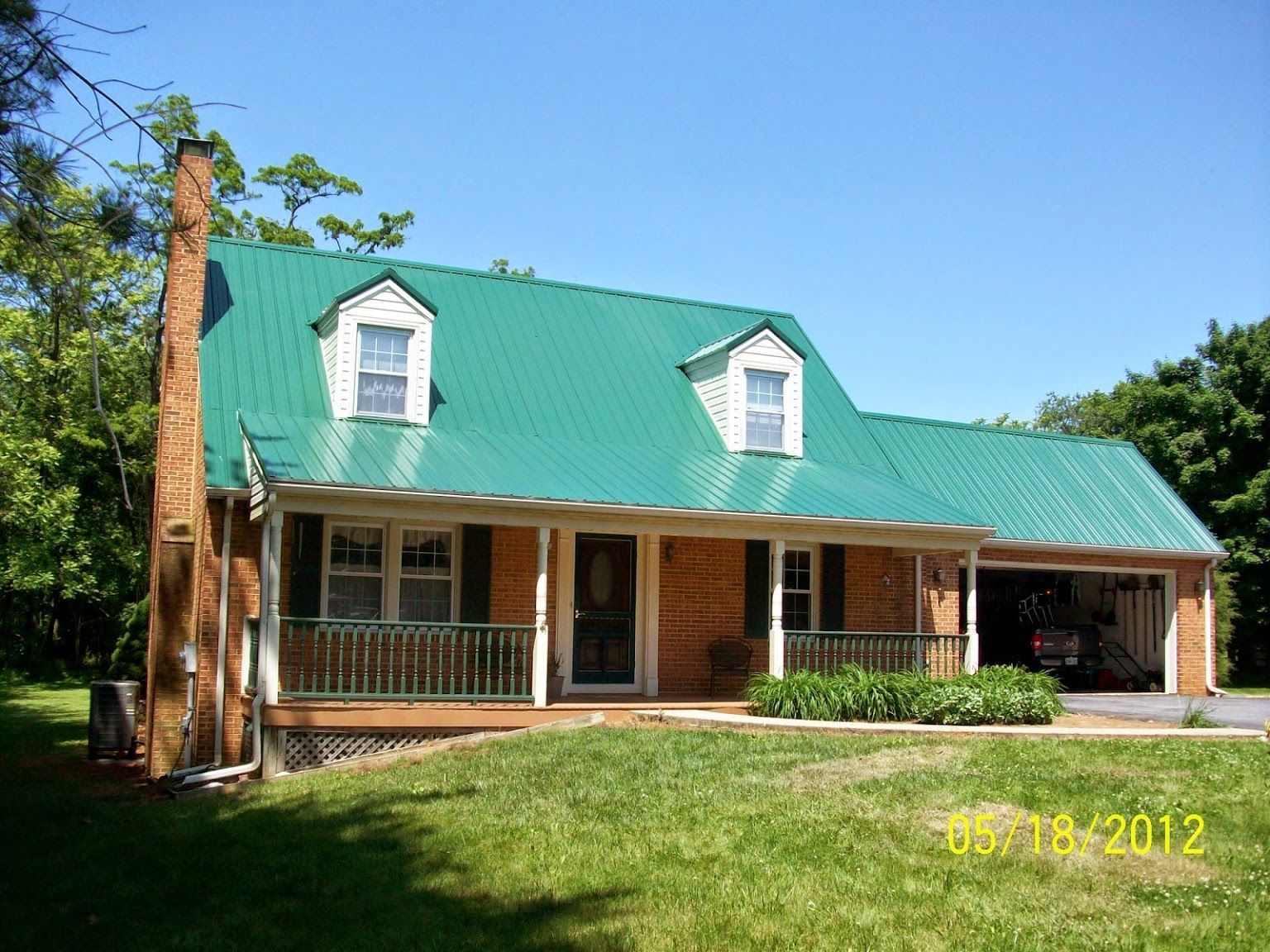 A picture of a house with a green roof was taken in 2012