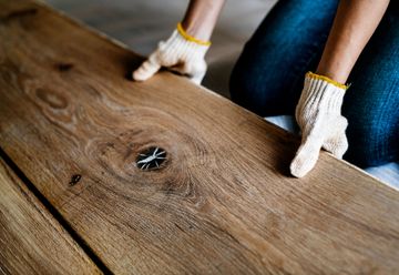 Hardwood planks being installed on a residential floor in Virginia