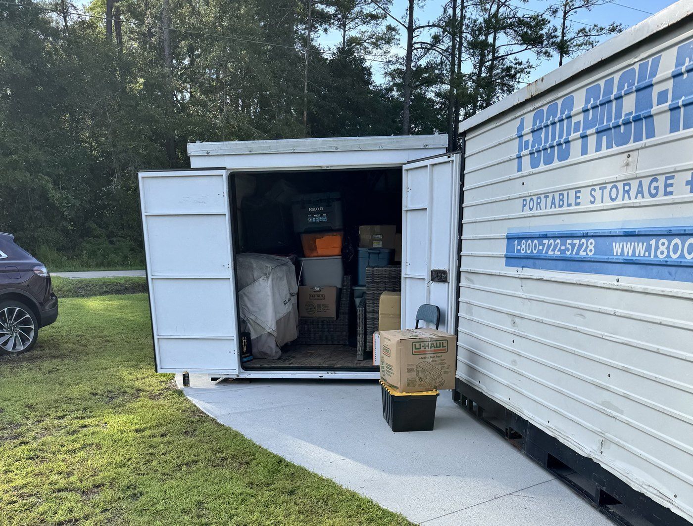 Makin Moves crew loading a PACK-RAT portable storage container
