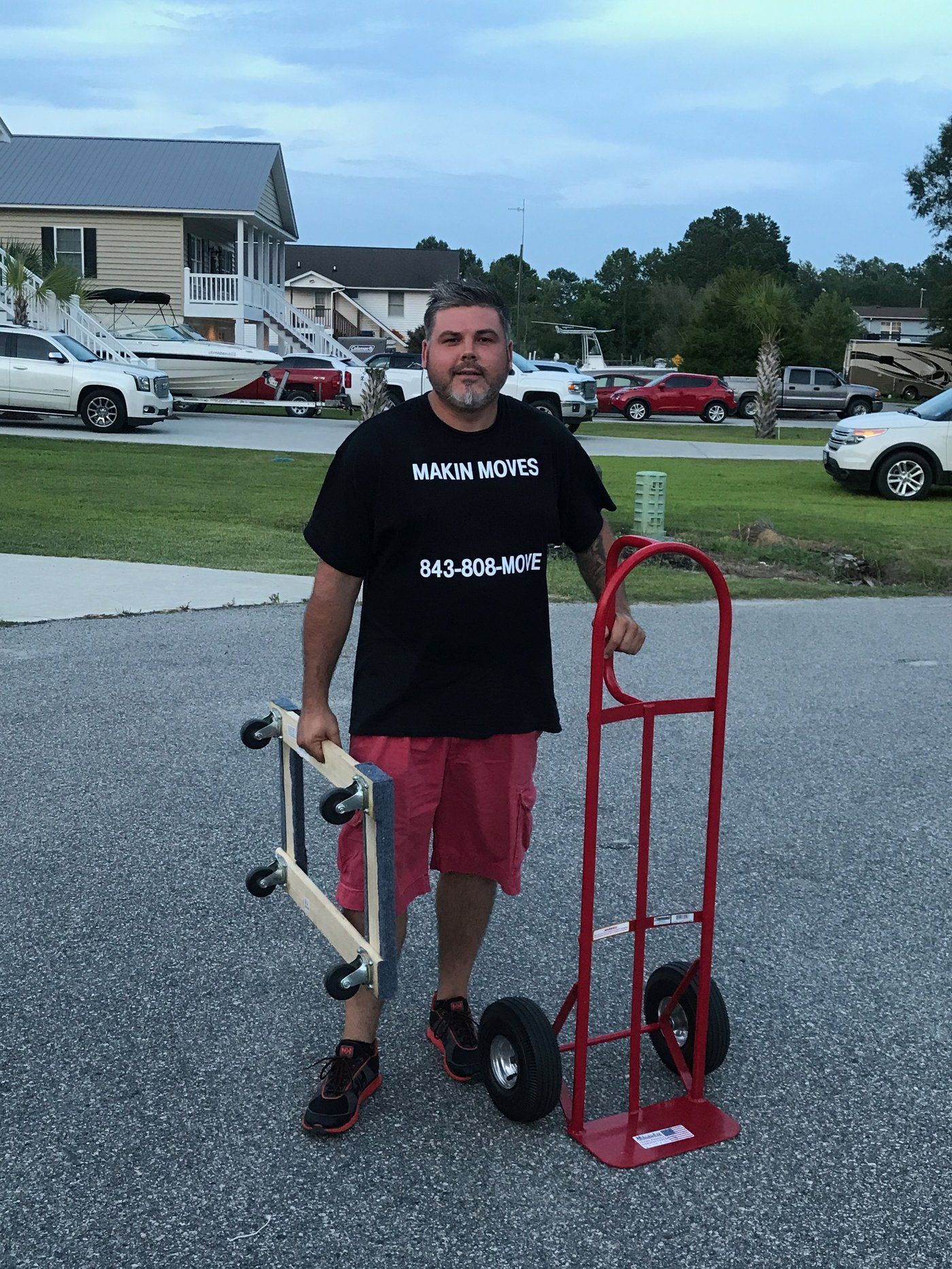 Makin Moves mover in branded uniform with hand truck and dolly on a Myrtle Beach job