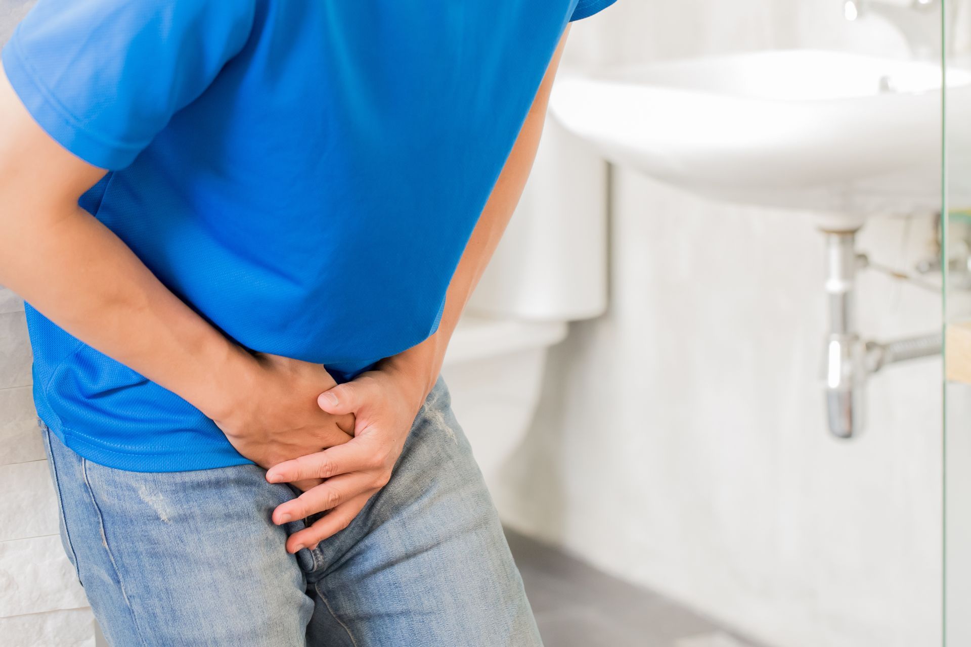 A man with bladder pain. A man with bladder pain.