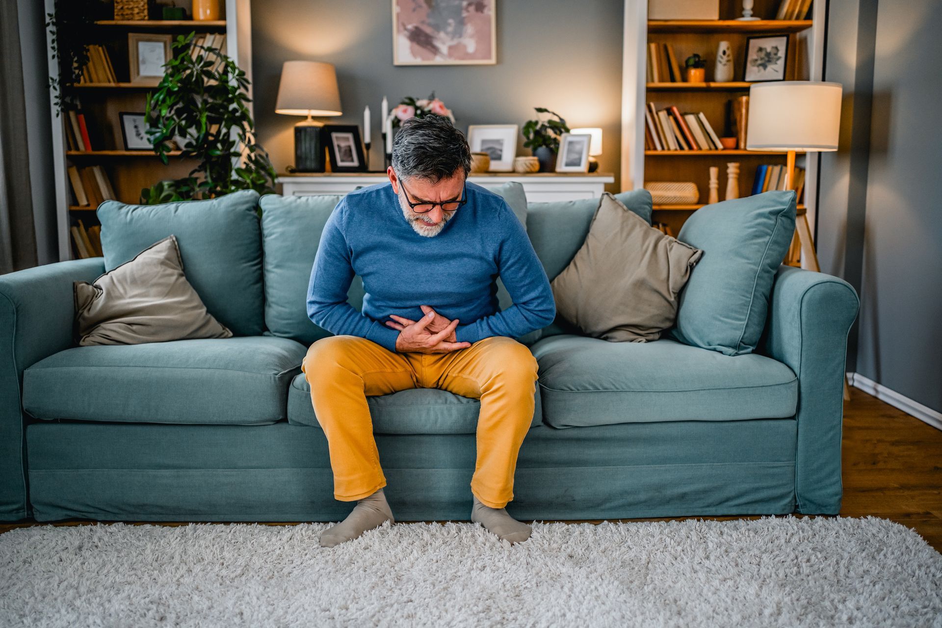 A man is suffering from bladder pain.