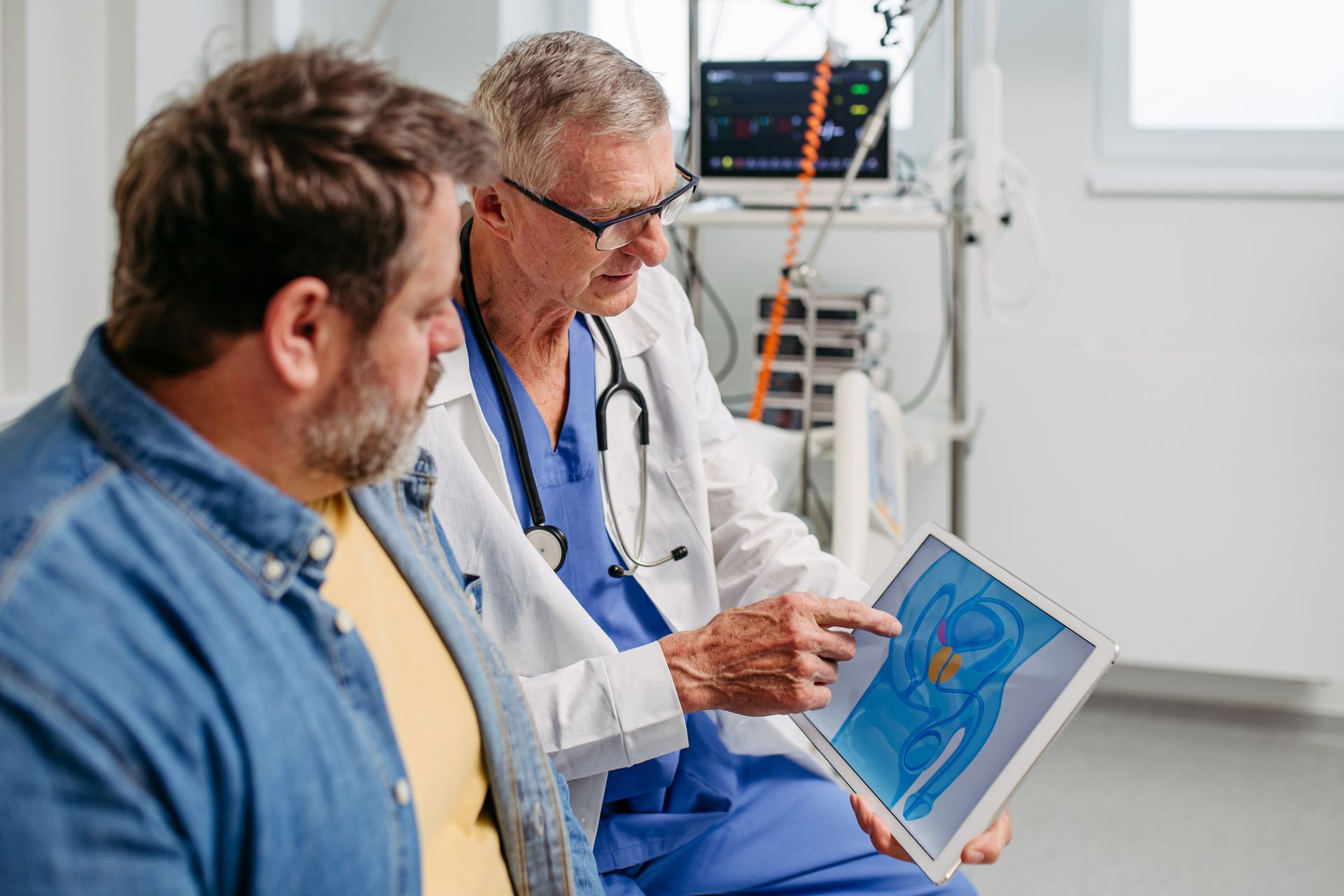 A doctor explaining a prostate exam to a patient during a routine check-up, at a clinic.