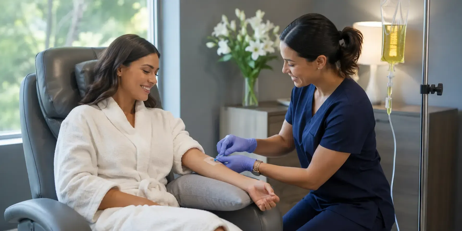 Medical professional administering ReHydrate Drip IV therapy to a relaxed patient in a comfortable, modern wellness room.