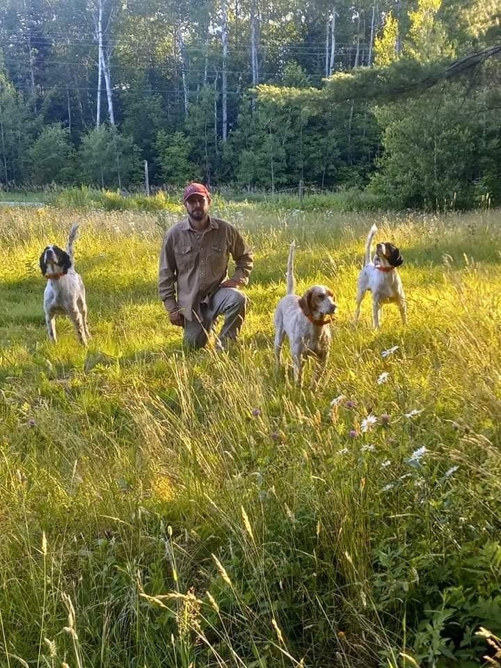 pointing dog trainer victor in front of dogs