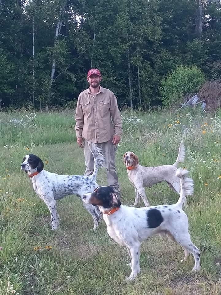 pointing dog trainer victor in front of dogs