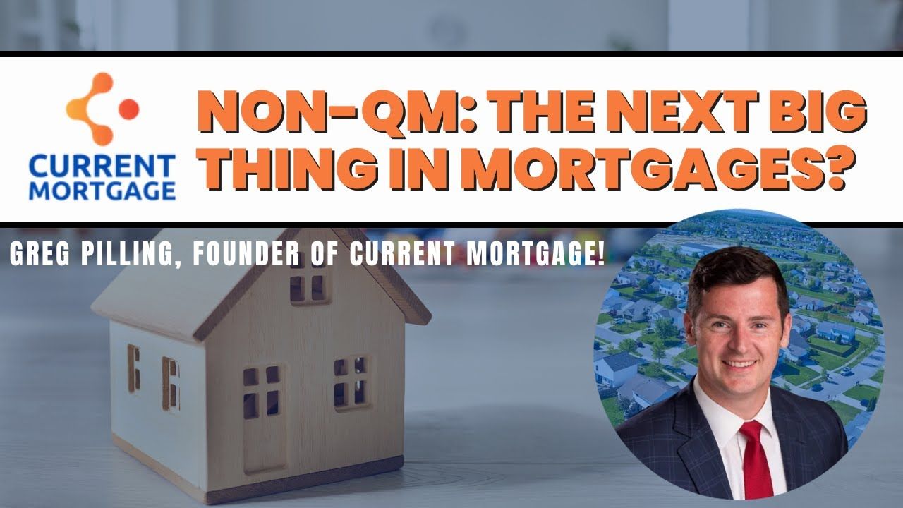 greg pilling in a suit and tie stands in front of a model house