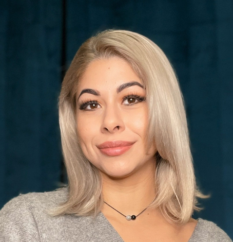 Deborah Espinosa, an executive board member for Nightlife Therapy and an Austin based aerial performer and personal trainer, smiles.