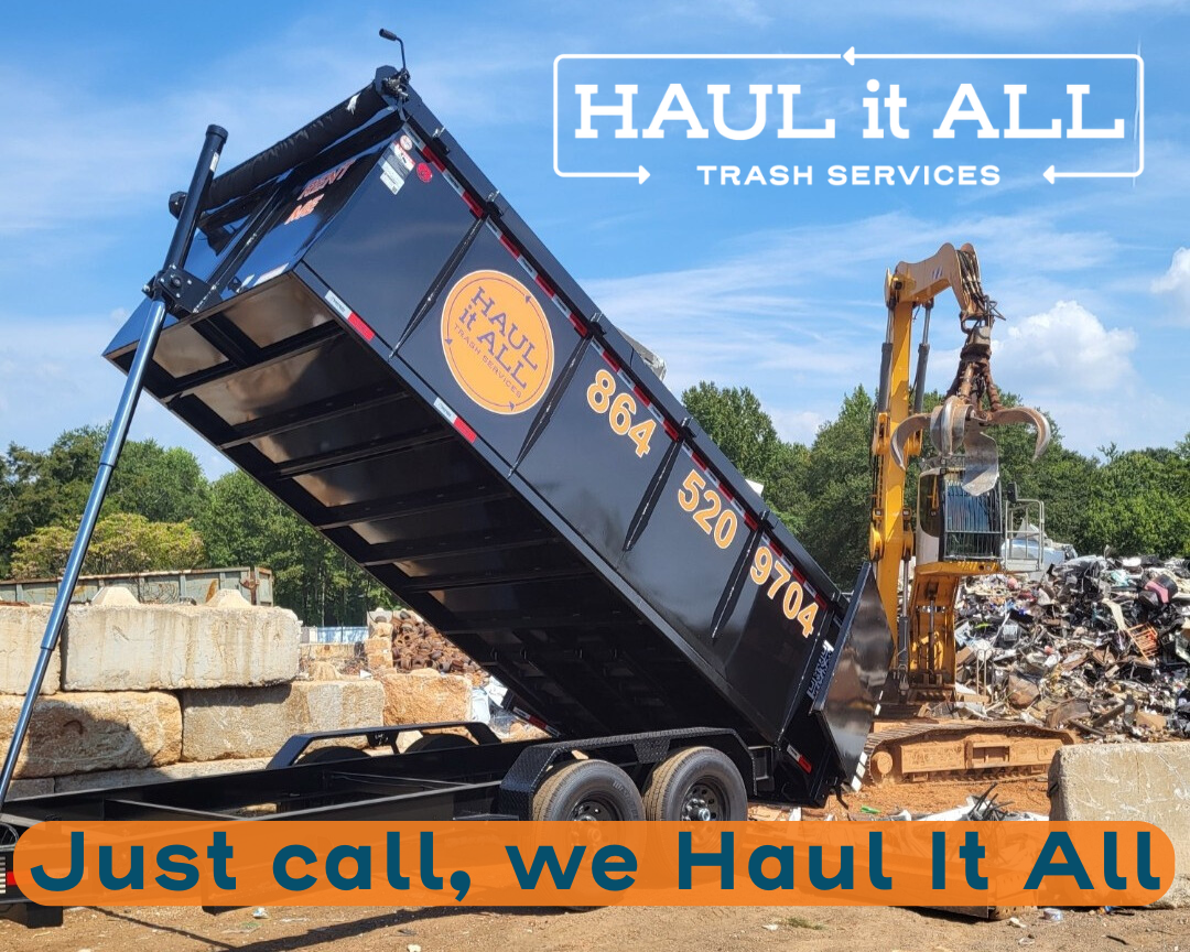 Black dumpster tilting at a scrapyard, with “HAUL it ALL” and “Just call, we Haul it All” text.