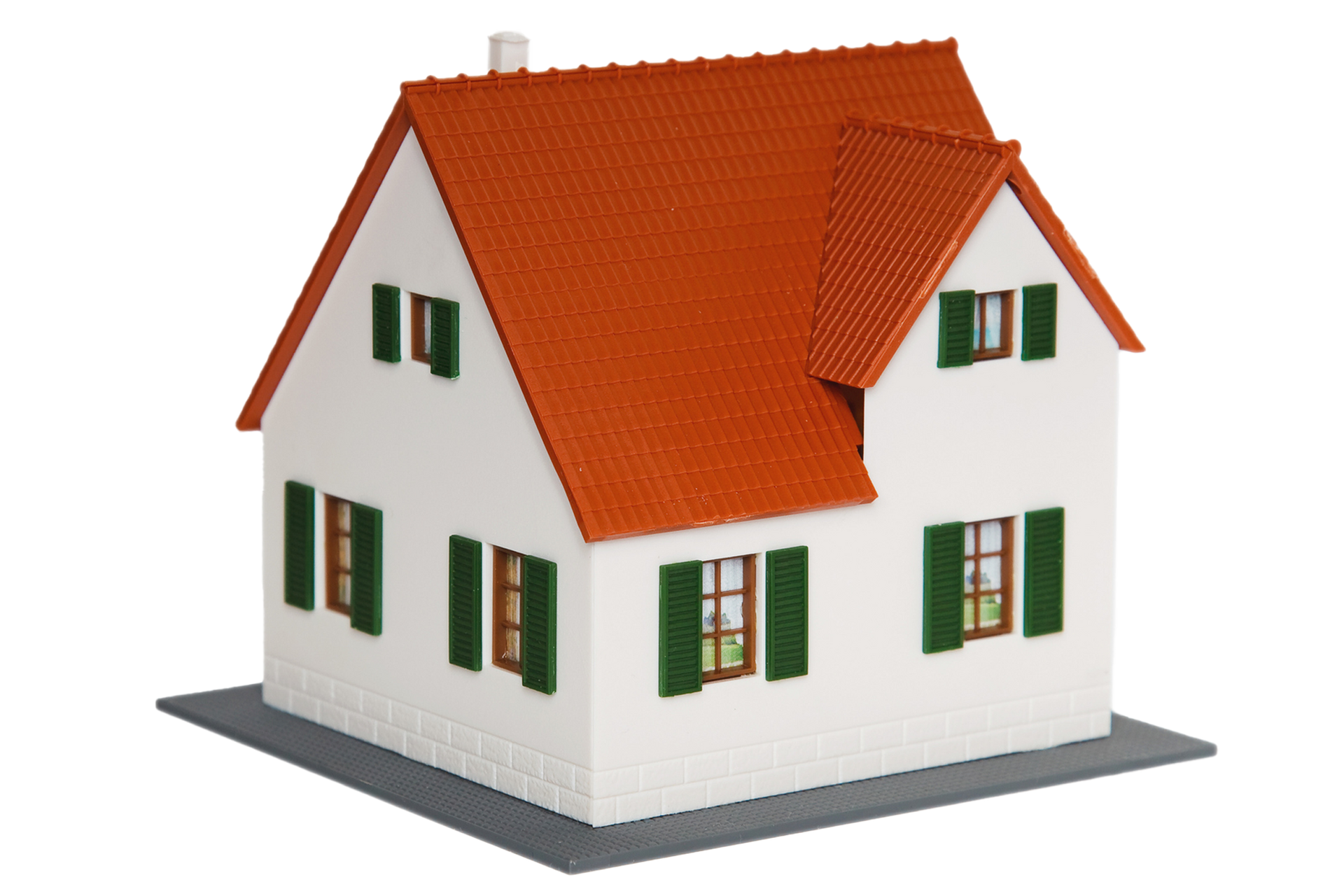 A model house with a red roof and green shutters A model house with a red roof and green shutters