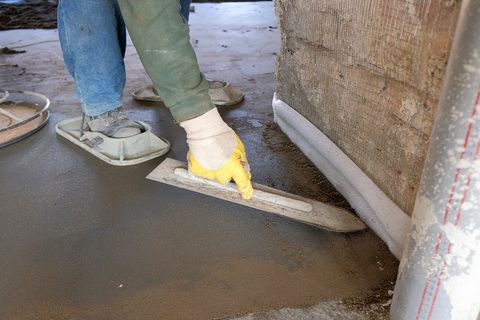 man resurfacing the concrete