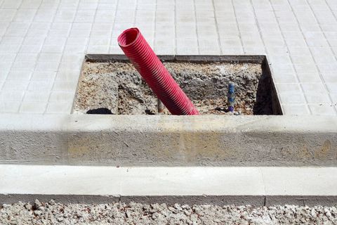 an excavation with red wire