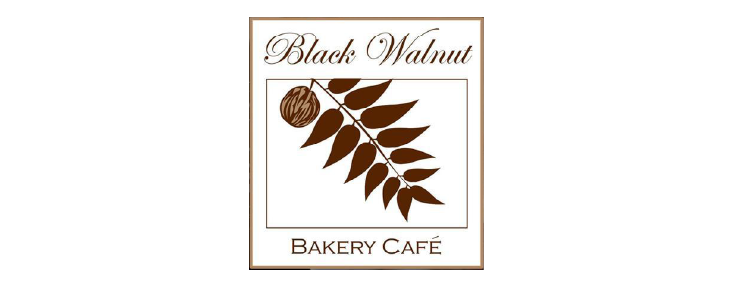 Logo for Black Walnut Bakery Café, featuring text and a brown walnut branch inside a square border.