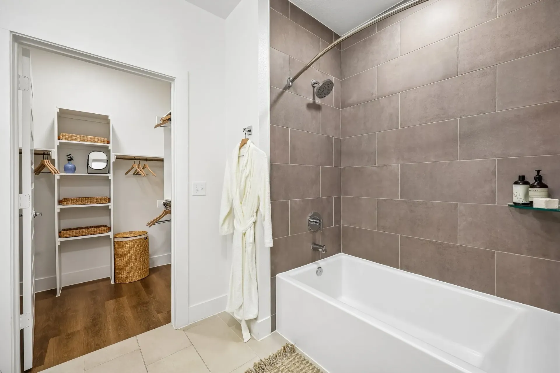 Bathroom with a bathtub, shower, and walk-in closet.