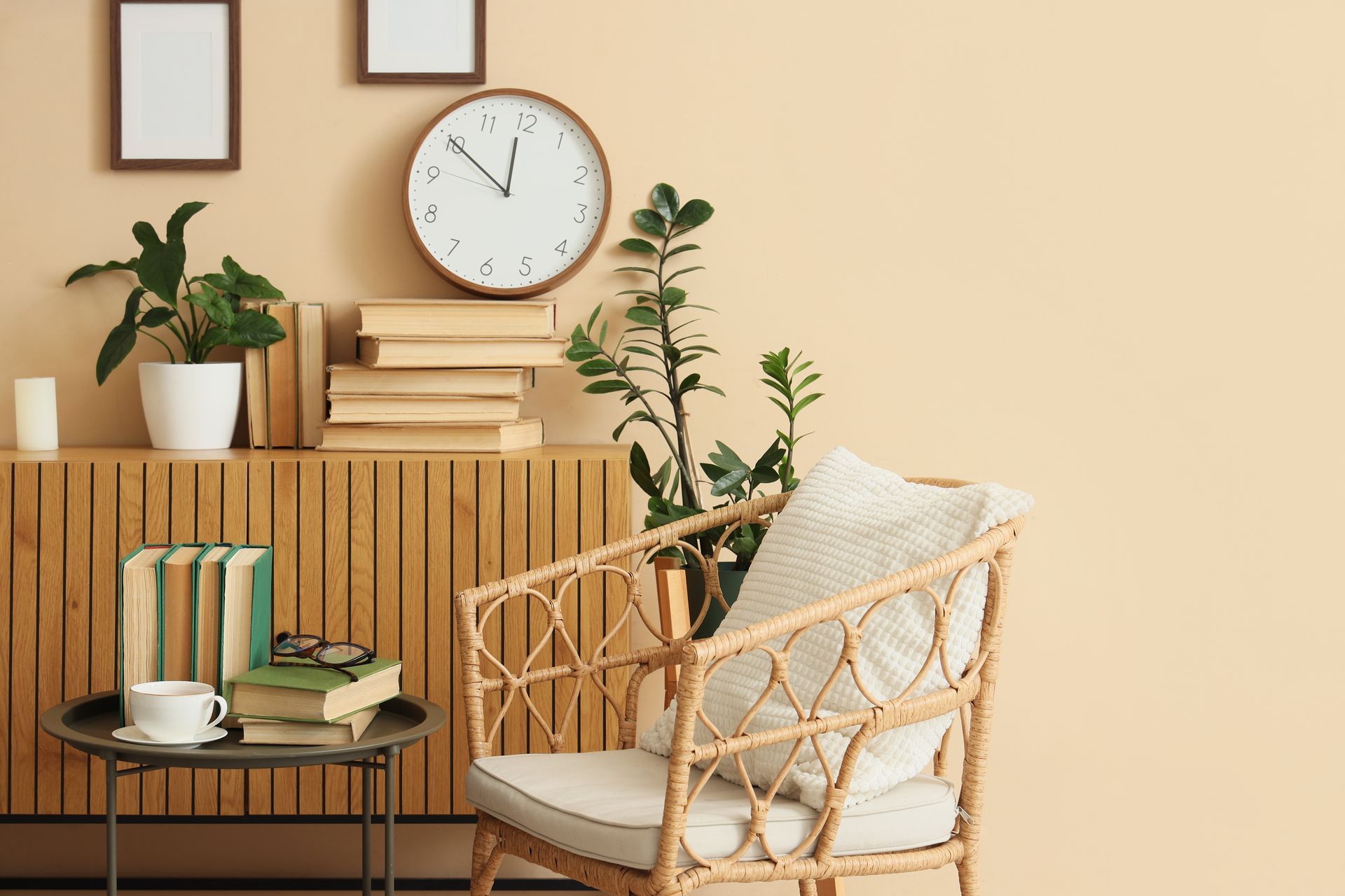 Interior plant design in a Chicago living space with potted plants and a rattan armchair