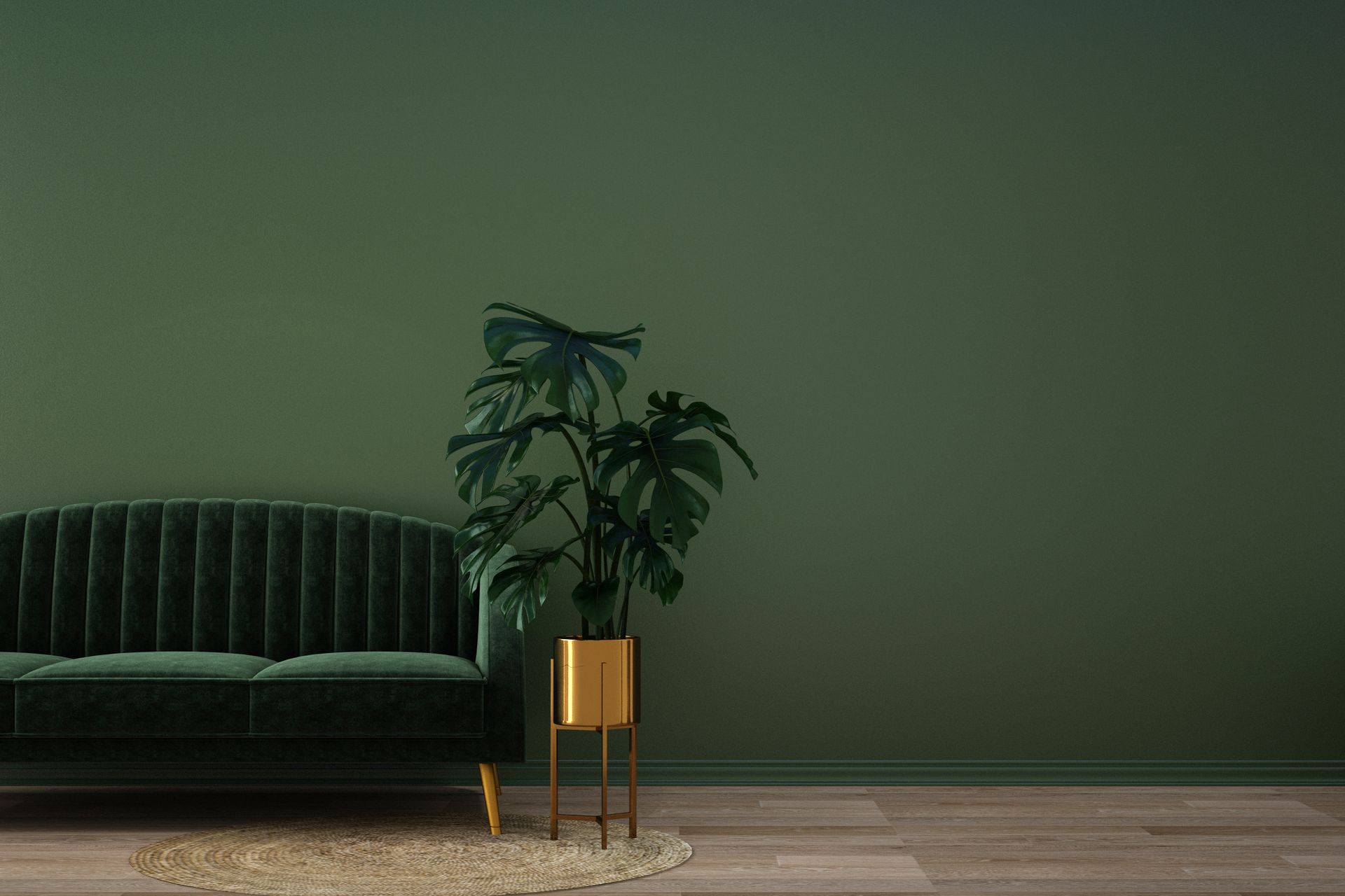 A minimalist living room corner featuring a dark green velvet sofa.