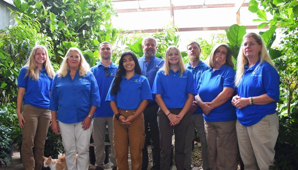 Smiling Group Of Zoo Staff.