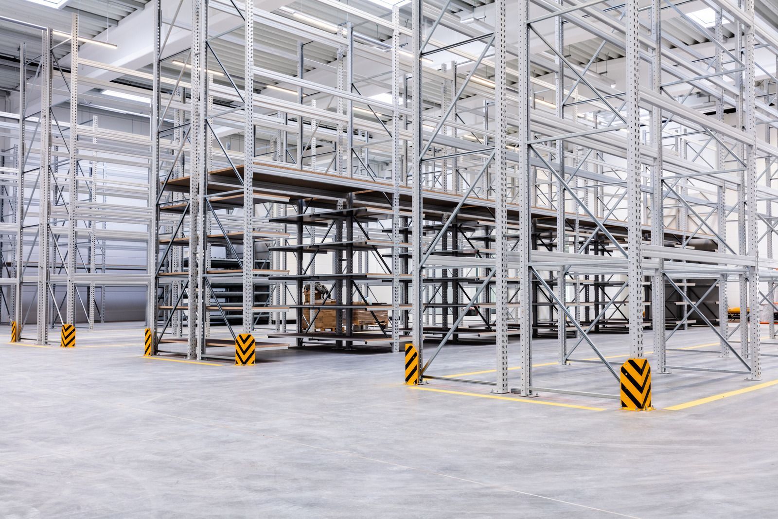 There are a lot of shelves in this warehouse.
