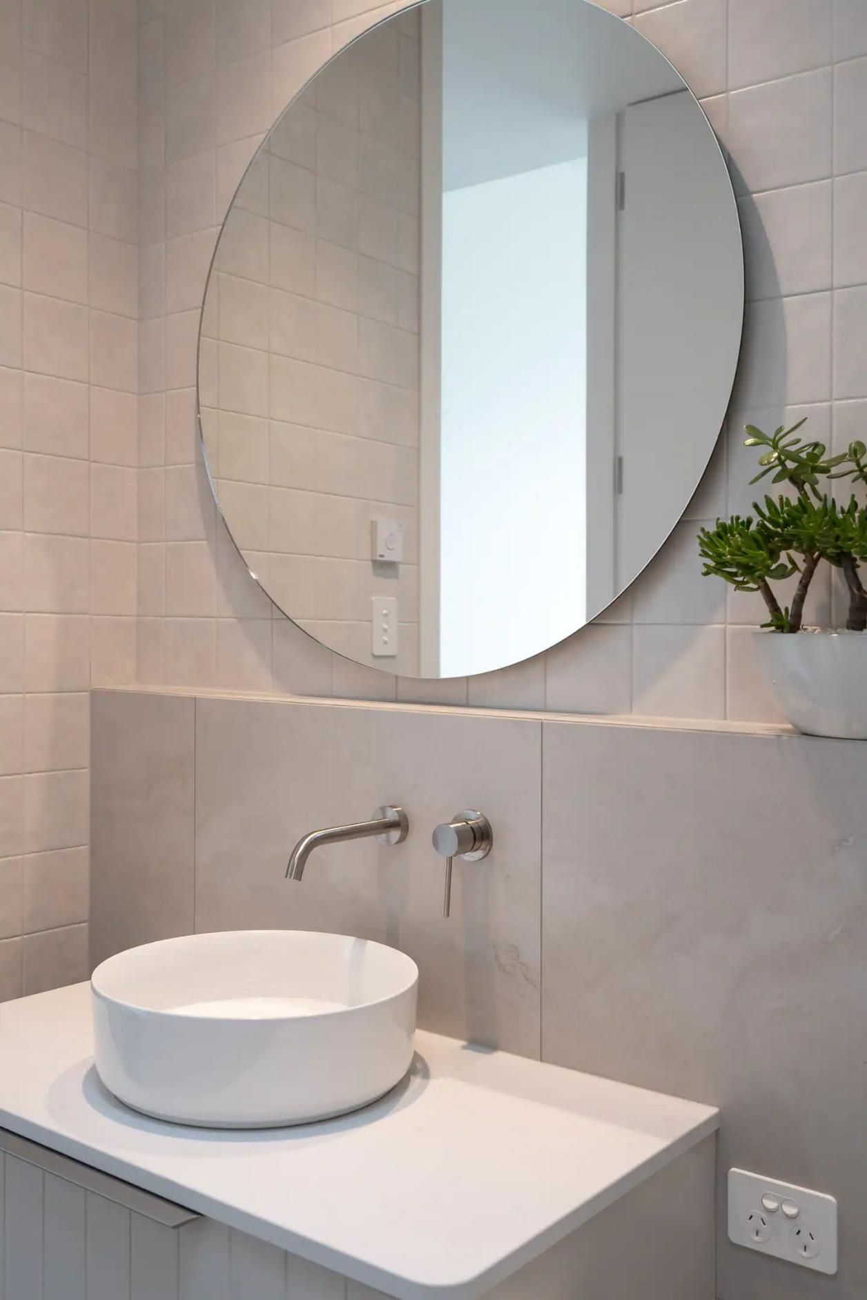 A Bathroom With A Sink and A Round Mirror — That Painter Guy In South Nowra, NSW