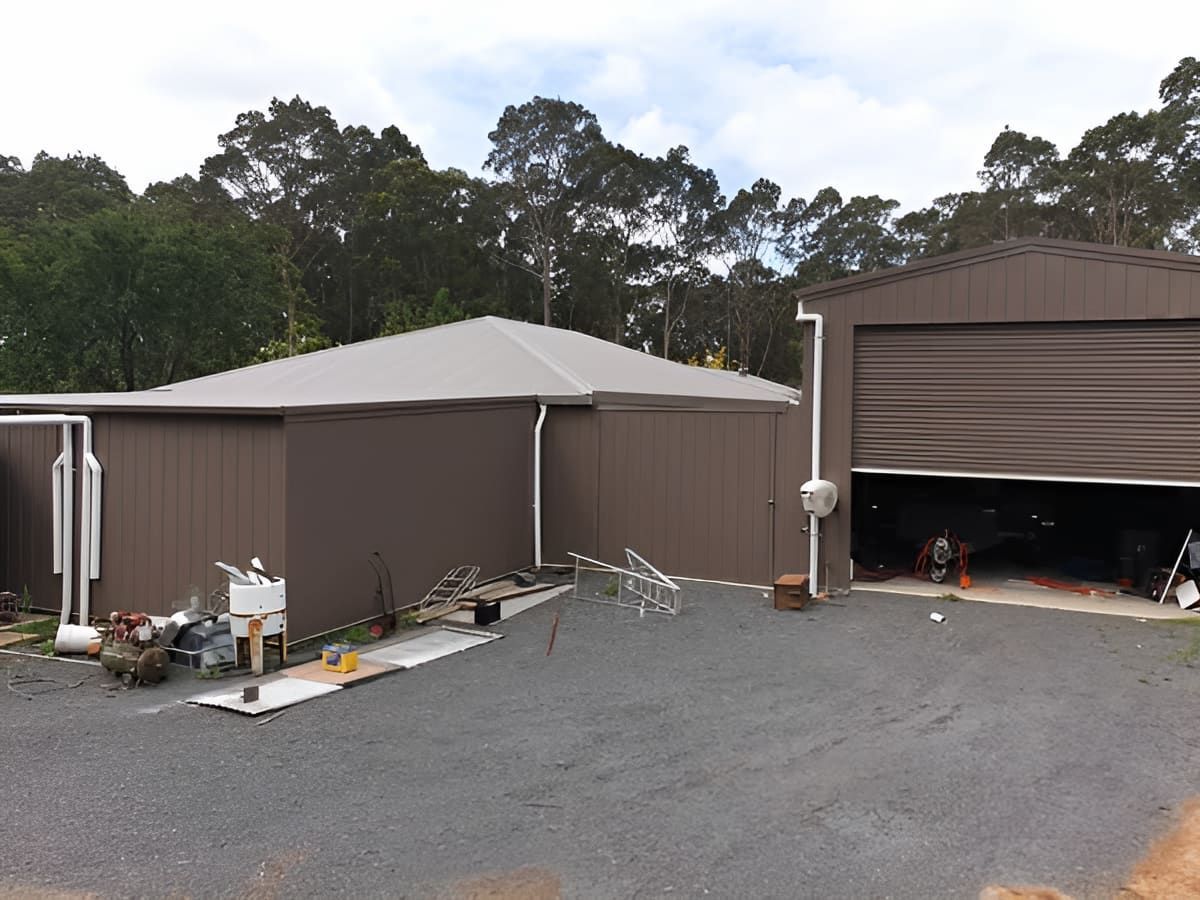 A House With A Garage Next To It And Trees In The Background — That Painter Guy In South Nowra, NSW