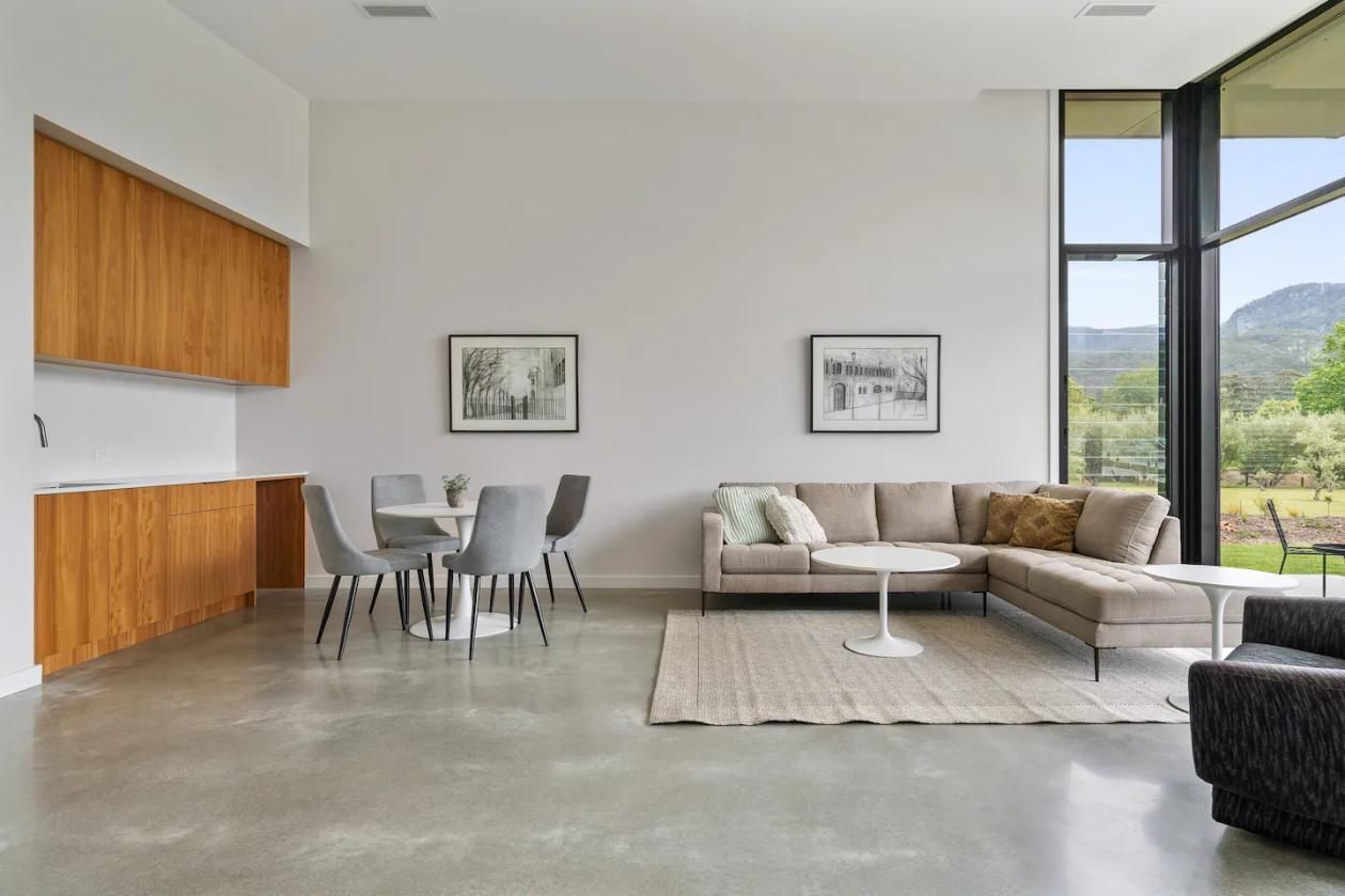 A Living Room With A Couch , Chairs , A Table and A Large Window — That Painter Guy In South Nowra, NSW