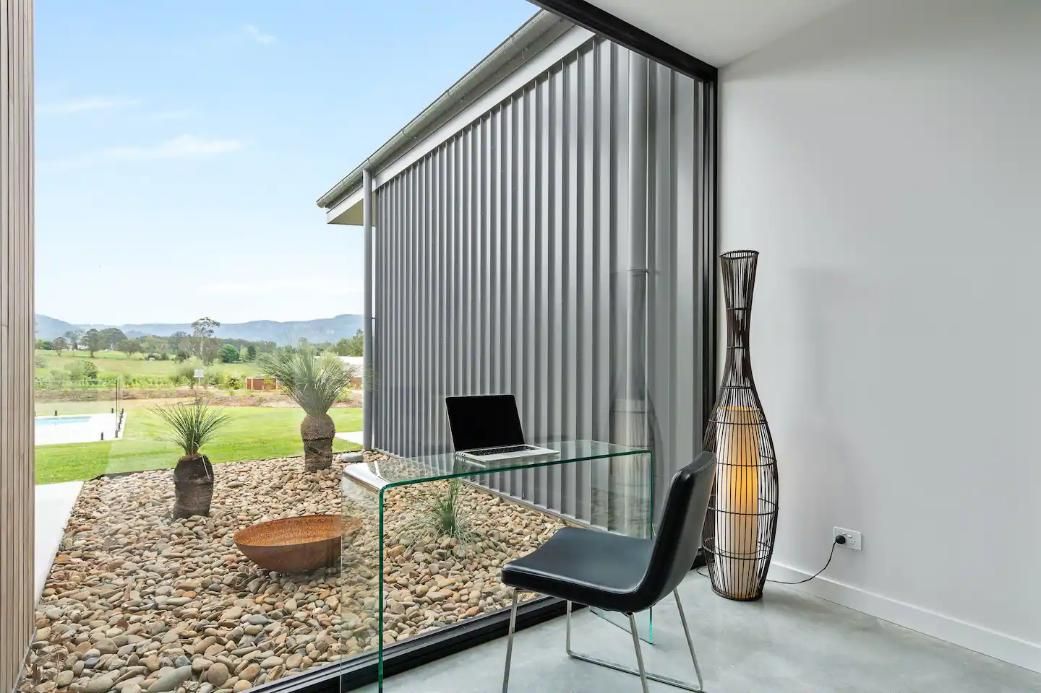 There Is A Desk With A Laptop On It In A Room With A Large Window — That Painter Guy In South Nowra, NSW