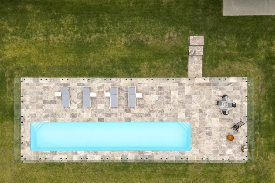 An Aerial View Of A Large Swimming Pool Surrounded By Grass — That Painter Guy In South Nowra, NSW
