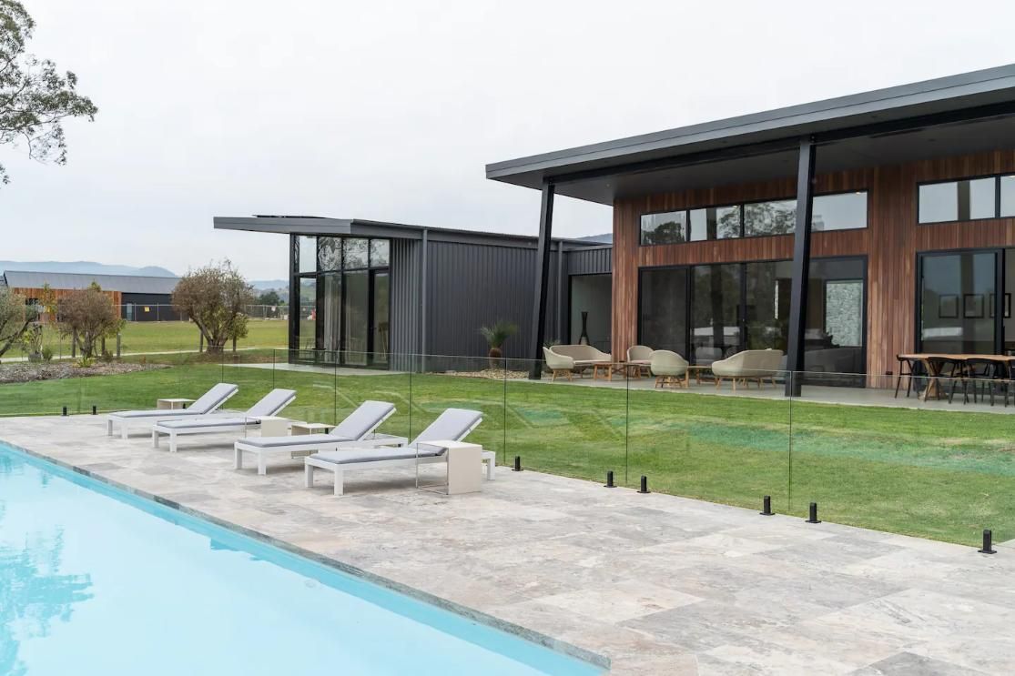 A Large House With A Swimming Pool In Front Of It — That Painter Guy In South Nowra, NSW