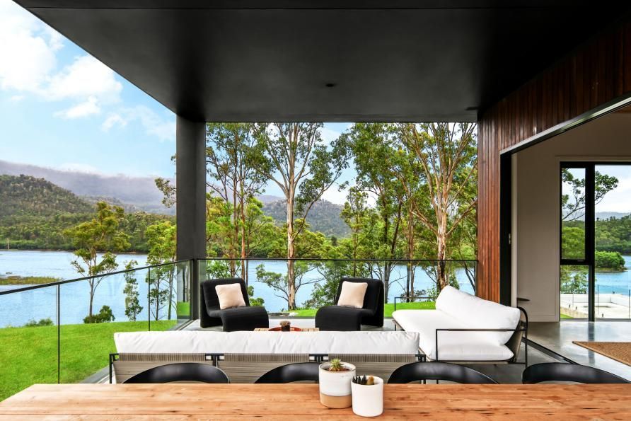 A Balcony With A Table and Chairs Overlooking A Lake — That Painter Guy In South Nowra, NSW