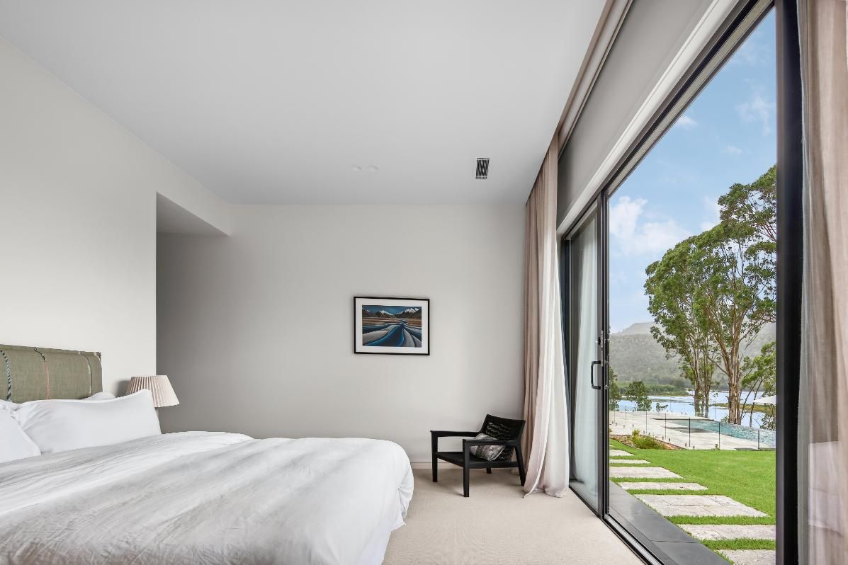A Bedroom With A Large Bed and A Sliding Glass Door — That Painter Guy In South Nowra, NSW