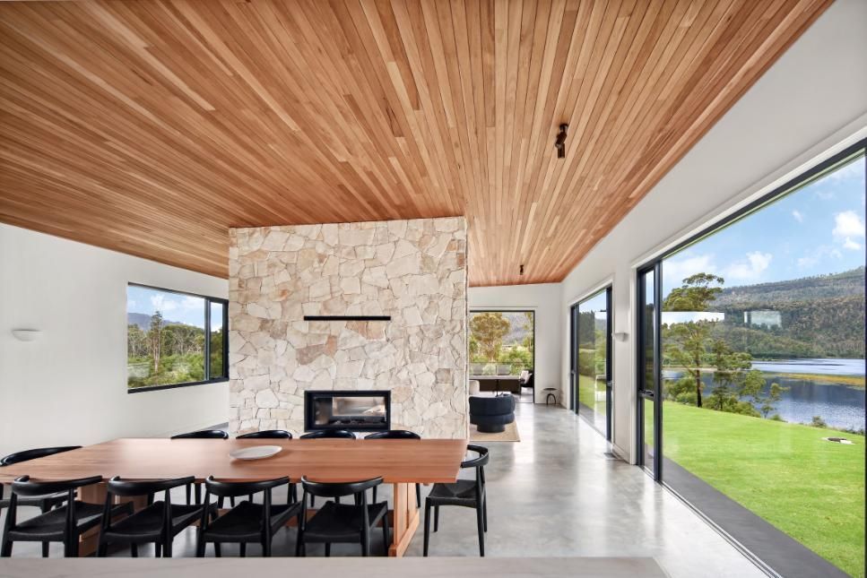 A Dining Room With A Wooden Table and Chairs and A Fireplace — That Painter Guy In South Nowra, NSW