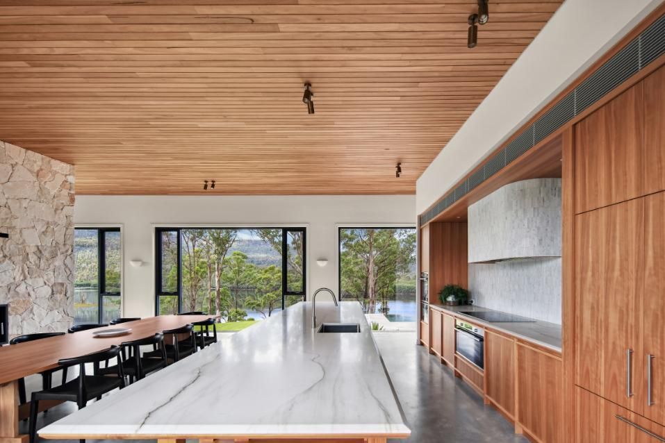 A Kitchen With A Marble Counter Top and Wooden Cabinets — That Painter Guy In South Nowra, NSW