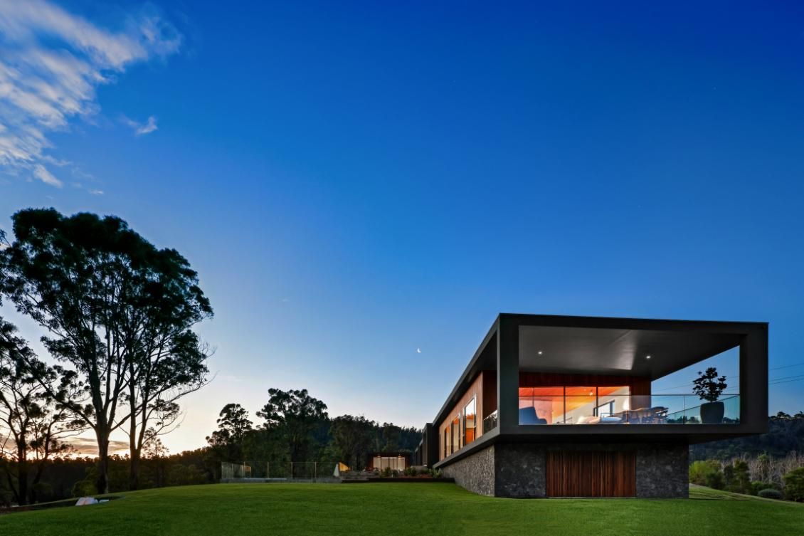 A Large House With A Lot Of Windows Is Surrounded By Grass and Trees — That Painter Guy In South Nowra, NSW