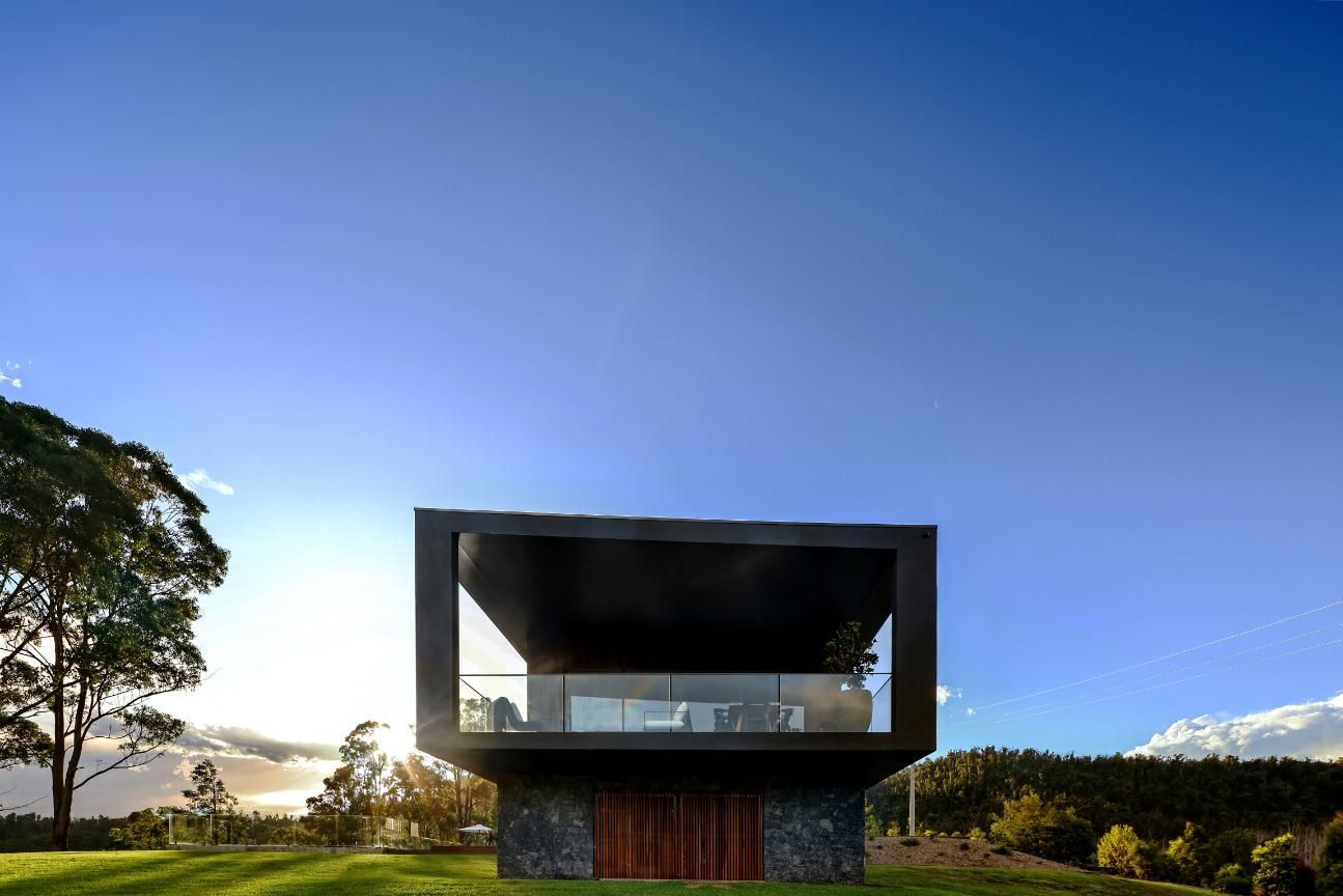 A Modern House Is Sitting On Top Of A Grassy Hill — That Painter Guy In South Nowra, NSW