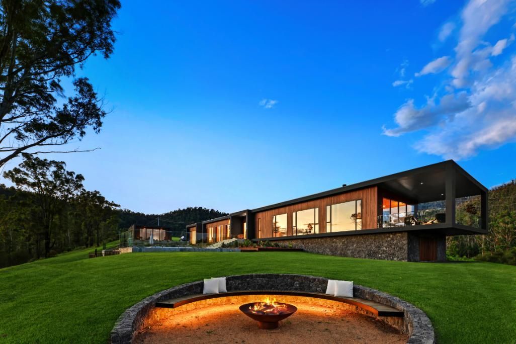 A Modern House With A Fire Pit In Front Of It — That Painter Guy In South Nowra, NSW