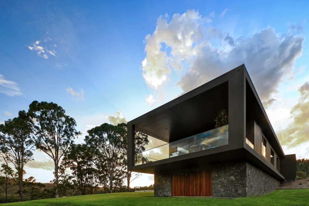 Modern House Is Sitting On Top Of A Lush Green Hillside Surrounded By Trees — That Painter Guy In South Nowra, NSW