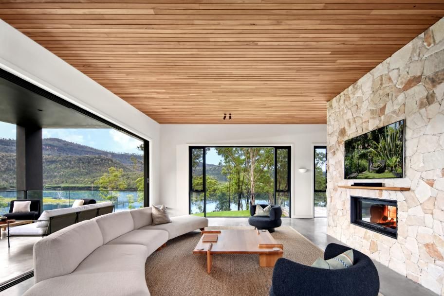 Living Room With A Curved Couch and A Fireplace — That Painter Guy In South Nowra, NSW