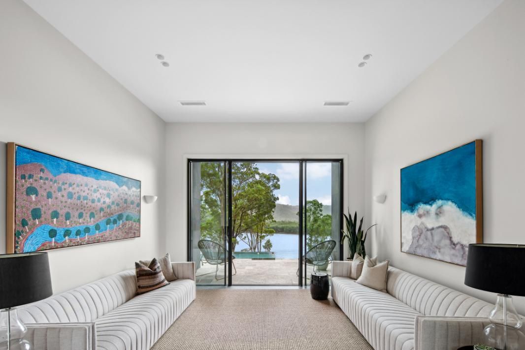 Living Room With A Lot Of Furniture and A Sliding Glass Door Leading To A Pool — That Painter Guy In South Nowra, NSW