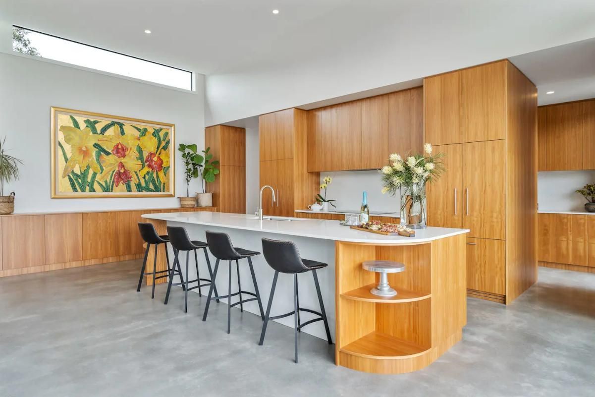 A Kitchen With A Large Island and Stools and A Painting On The Wall — That Painter Guy In South Nowra, NSW