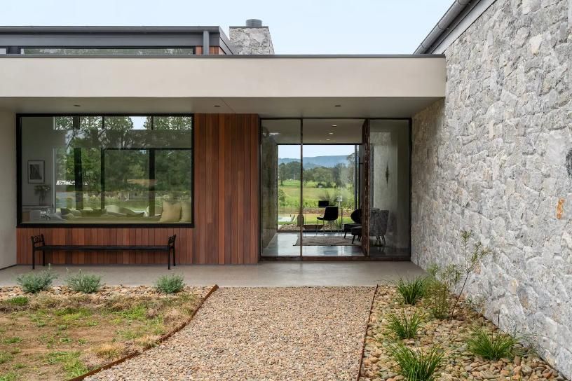A Modern House With A Stone Wall and Sliding Glass Doors — That Painter Guy In South Nowra, NSW
