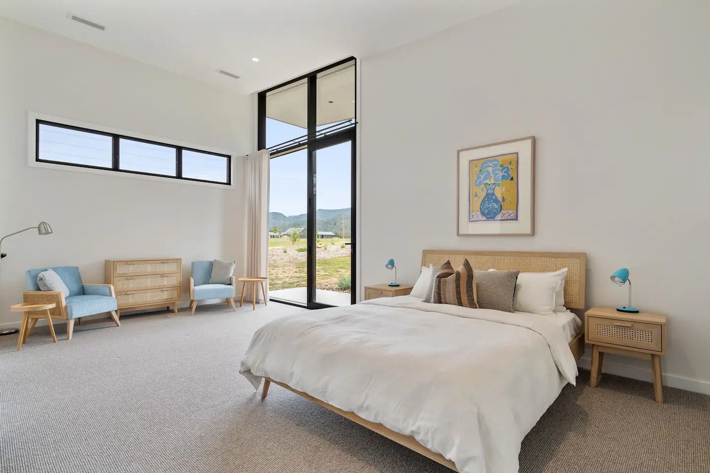 There is a large bed in the middle of the room. — That Painter Guy In South Nowra, NSW