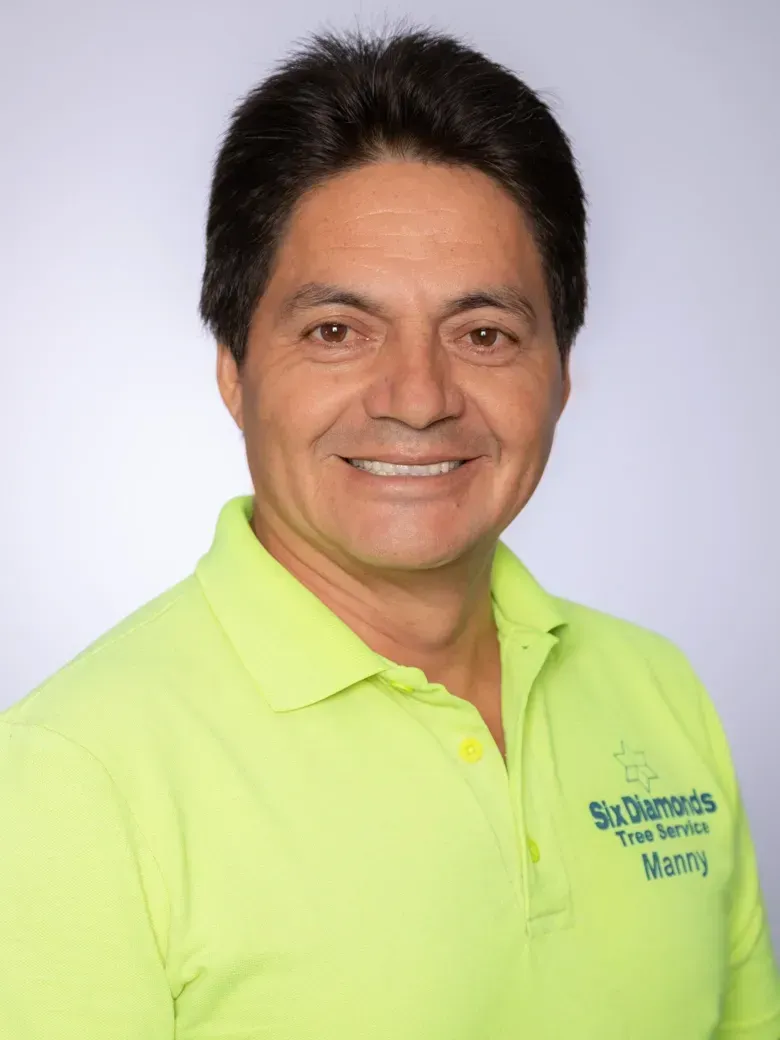 Our Vice President, Manny, wearing a neon green shirt with the word worth on it