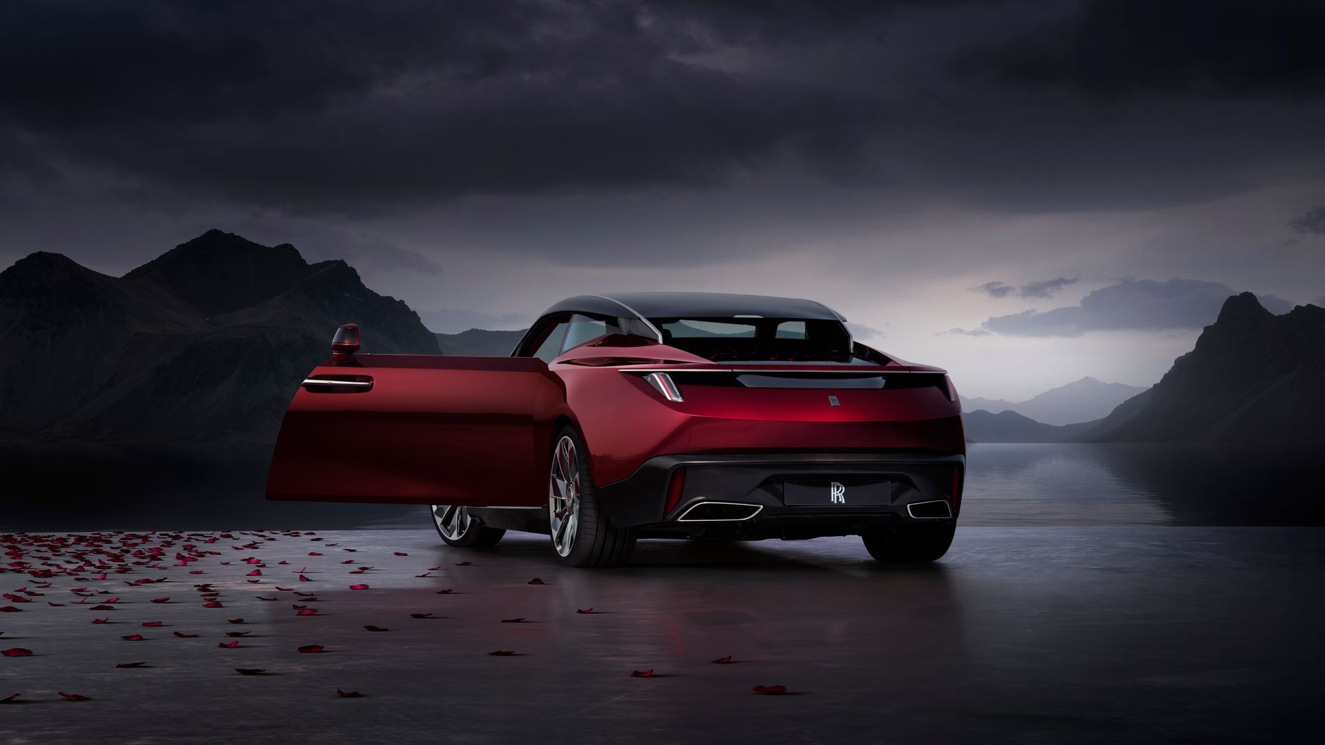 A Red Car Is Parked In Front Of A Lake