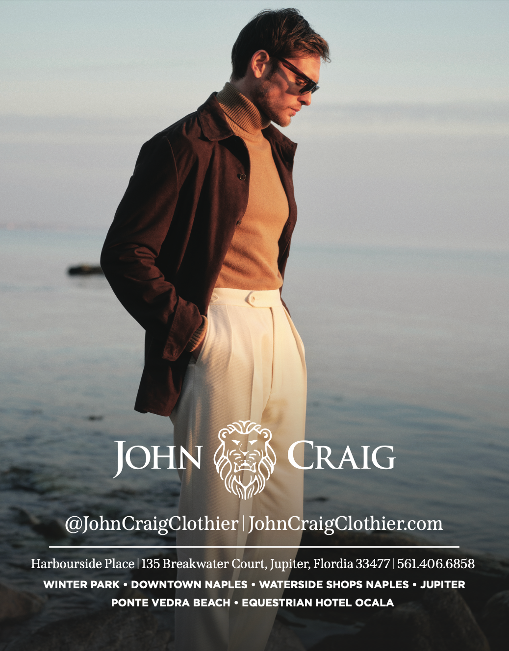 Man in stylish clothing, by water.  Brown jacket, tan turtleneck and pants. John Craig Clothier ad.