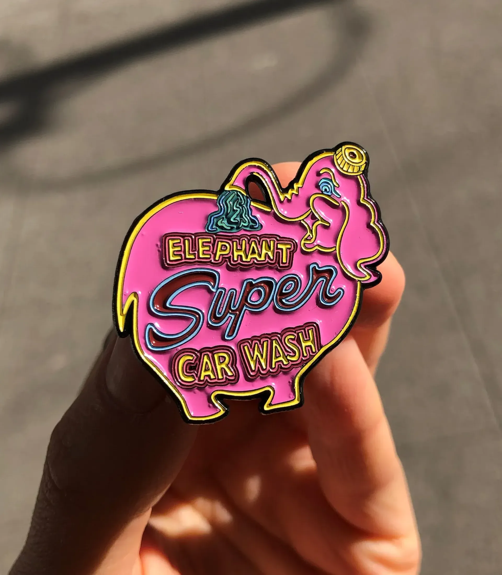 By the mid 90s, Seattle's Elephant Car Wash was more than just a place to clean your car—it was a cultural icon. Our pink elephant sign became one of the city's most photographed landmarks and appeared in various media, including a 1995 Land Rover commercial, cartoons, and fine art. The cheerful elephant spraying itself with water captured the imagination of many and spread our quirky charm nationwide using various media channels.